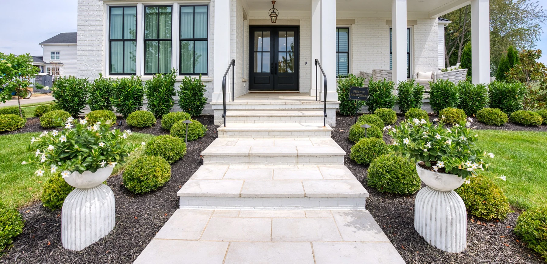 Paving that frames a garden entrance