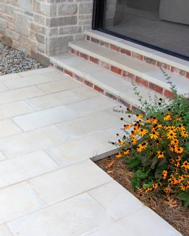 Pavers meeting brick steps