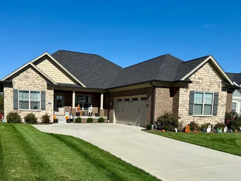Stone exterior with a covered porch