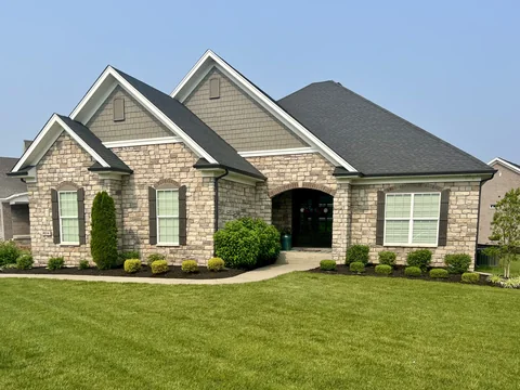 Stone facade with an arched entry